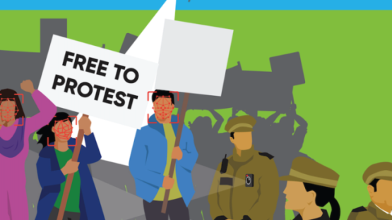 Illustration of a protest with police watching, with a placard stating 'FREE TO PROTEST' 