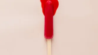 A melting red ice lolly that looks a little like a used tampon